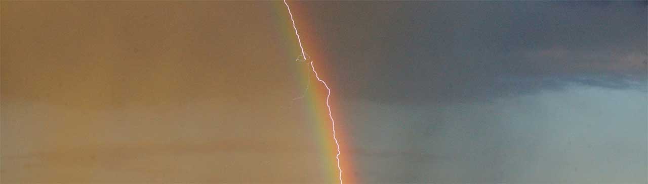 Lightning Hits Plane Inside Rainbow